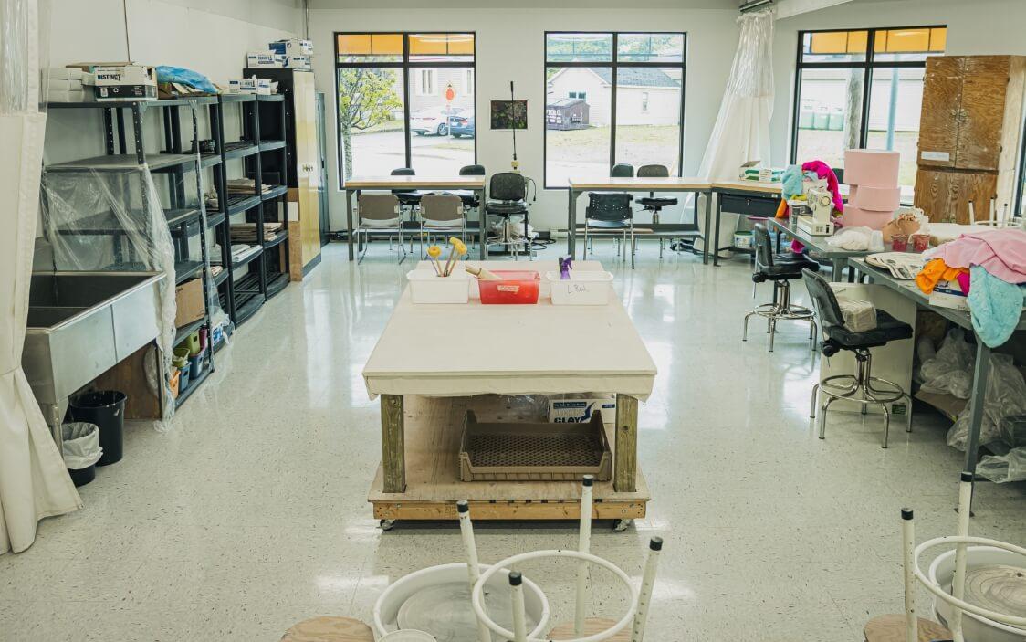 Creative studio equipped with pottery and sewing tools